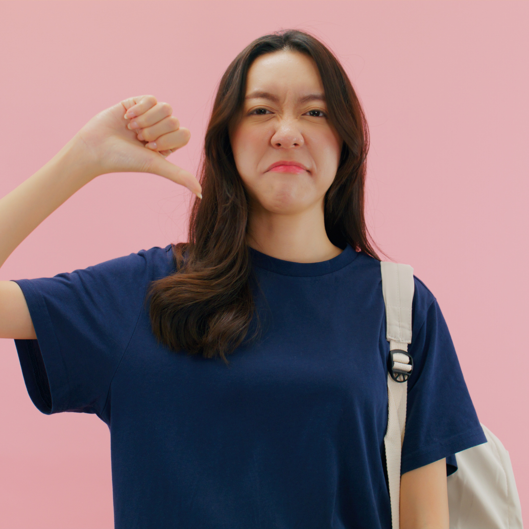 Thoughtful woman in green sweater weighing both sides, illustrating emotional conflict and the idea that two things can be true